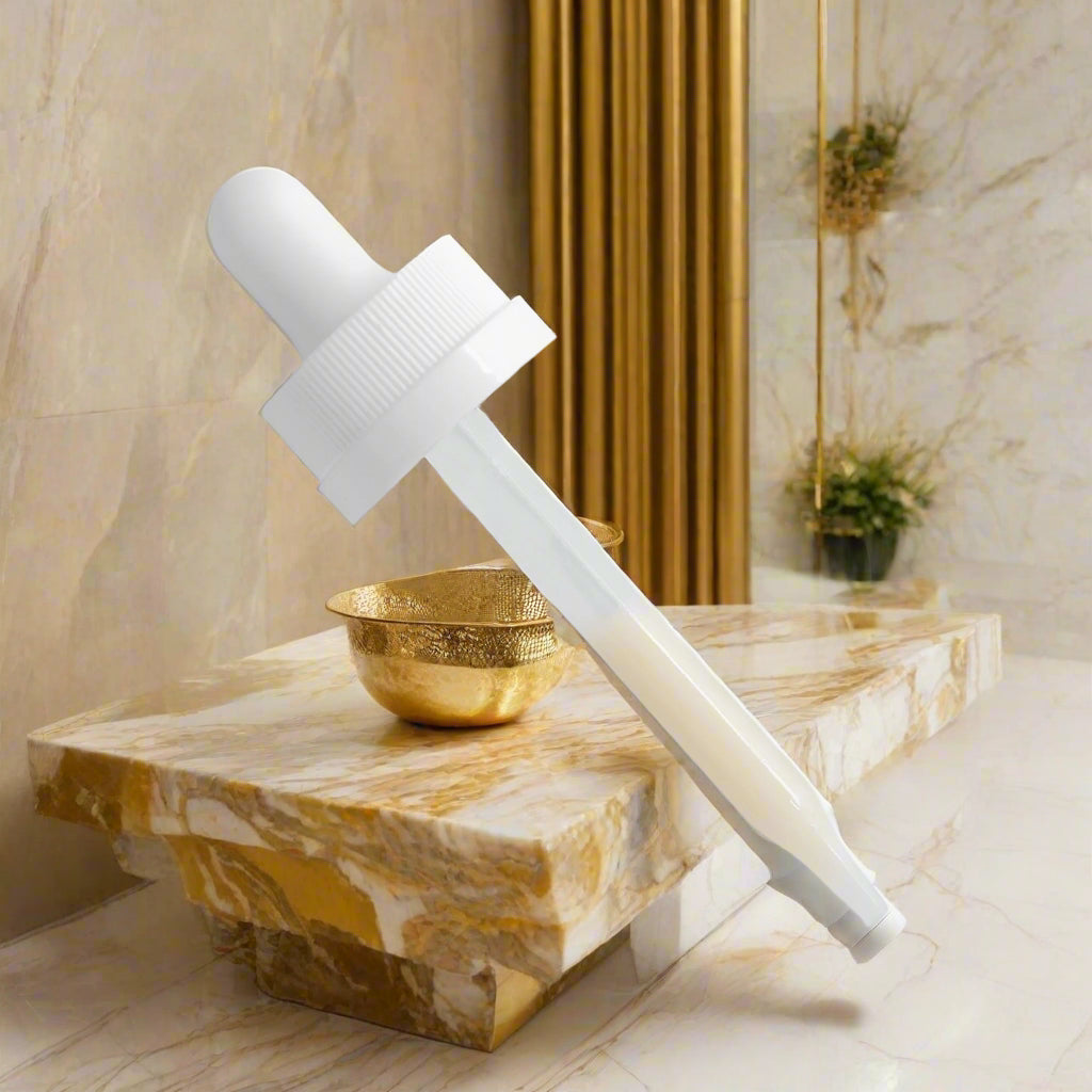 White dropper bottle for almond skin cosmetics skincare by Shuntia Symonette