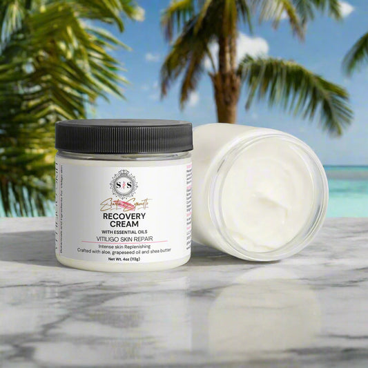 Jar of recovery cream on a marble surface with green leaves in the background