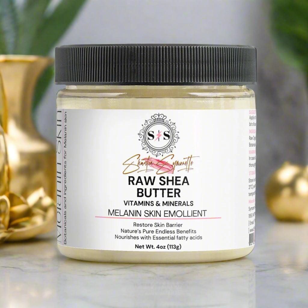Jar of raw shea butter with a black lid on a white background